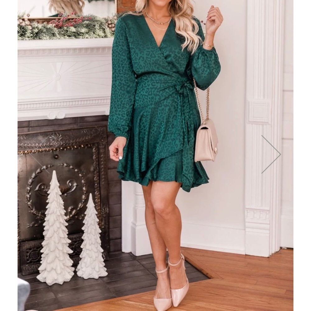 Size small satin emerald green wrap dress. Very flattering! Never worn
